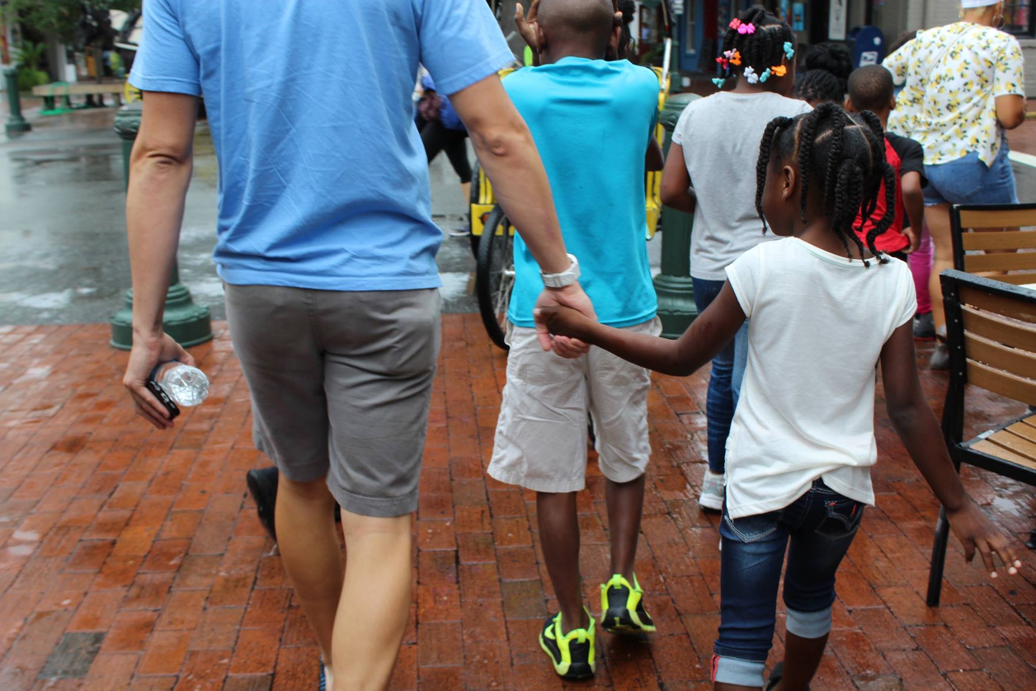 Adults and children working together at a craft station at a Cops 'n Kids event