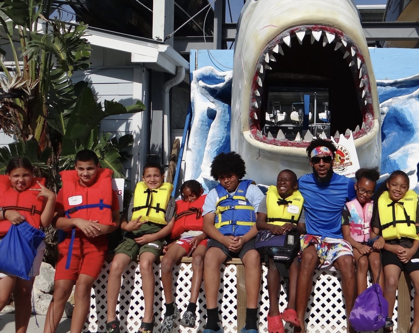 Group of children wearing life vests on a Cops 'n Kids water activity field trip
